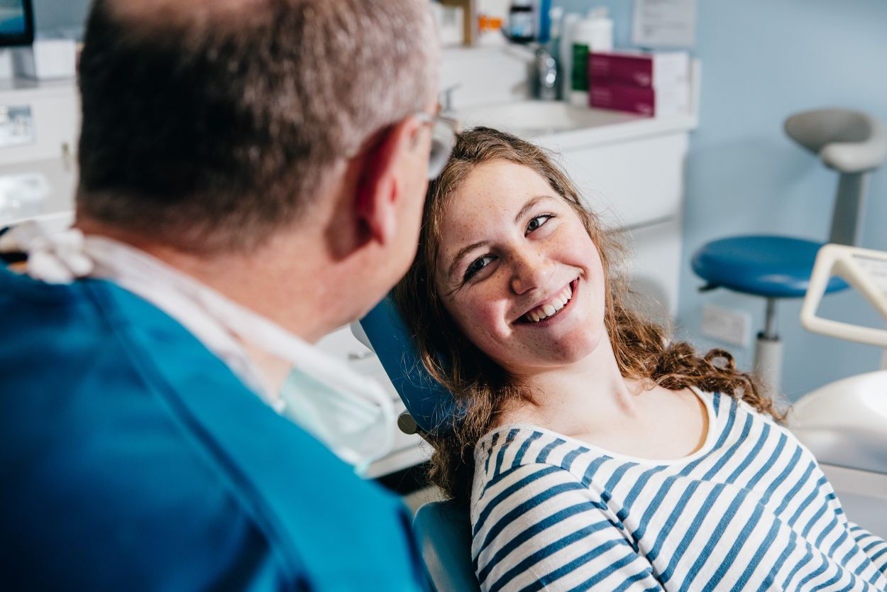 patient with dentist talking about Quick Straight Teeth in Darlington